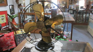 HGE electric fan with brass blades and steel cage.